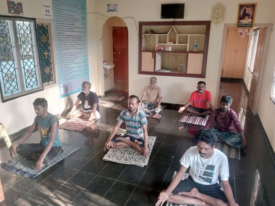 Residents seated together in the therapy hall at Dunamis, Madurai